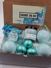 Load image into Gallery viewer, Spa Pure Luxury Spa Kit - Pure Bliss - 3 XL Pure Bliss Bath Fizzies, 3 Pure Bliss shower steamers, 3 Heart-shaped soaps, one 3.5 oz Pure Bliss whipped soap scrub, 1 Roll-on Perfume, Perfect for a mini-spa treatment.