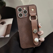 Load image into Gallery viewer, Camellia wristband iPhone15 iPhone case 14promax light luxury leather 13 suitable for 11 autumn and winter retro