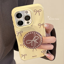 Load image into Gallery viewer, Gilt polka dot bow holder Apple 17 mobile phone case iphone16promax is suitable for 14 personalities 16 all-inclusive.