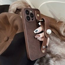Load image into Gallery viewer, Camellia wristband iPhone15 iPhone case 14promax light luxury leather 13 suitable for 11 autumn and winter retro