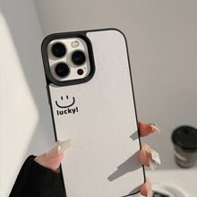 Load image into Gallery viewer, ins smiley face Apple mobile phone case 17pro max lambskin 11 is suitable for iPhone16, simple personality 15 anti-drop.