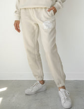 Load image into Gallery viewer, Our World Needs Jesus Beige Unisex Sweatpant
